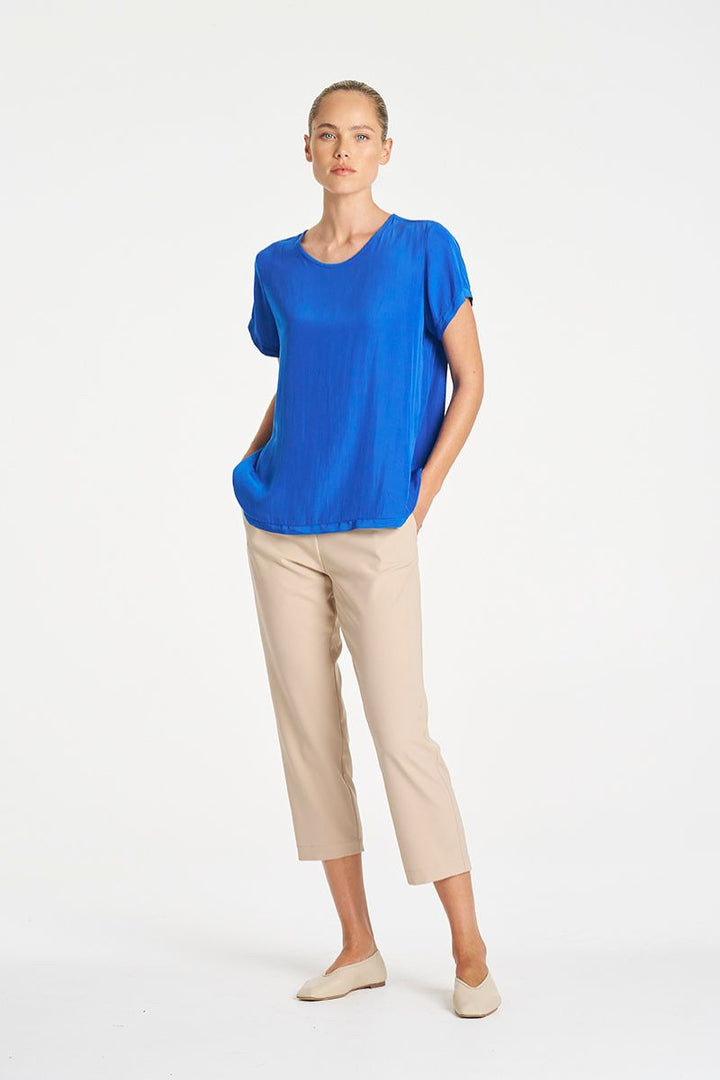 Woman wearing Travel T in Lagoon Mache by Mela Purdie styled