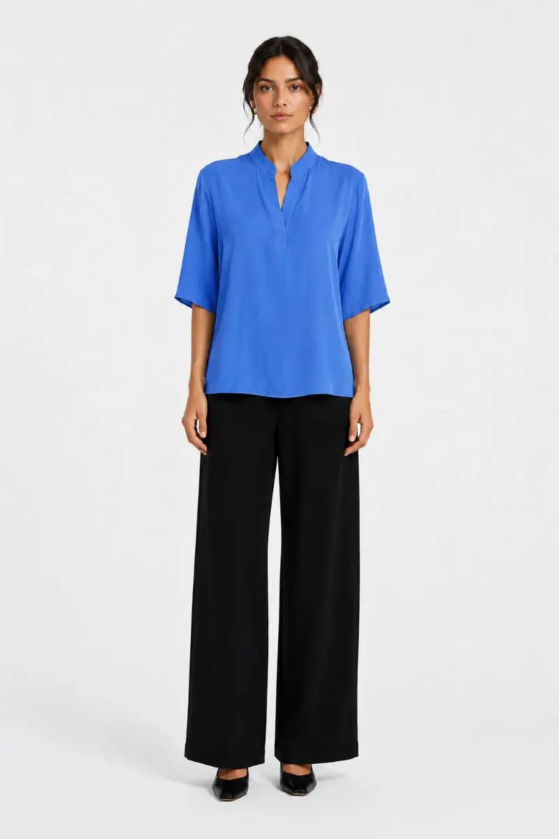 Woman wearing Placket Plaza in Lagoon Mache by Mela Purdie styled