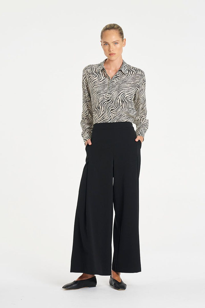 Woman wearing Soft Shirt in Fossil Silk Print by Mela Purdie styled