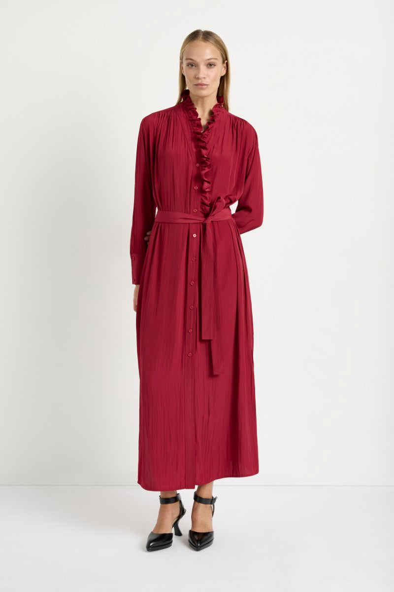 Woman wearing Frill Neck Dress in Chilli by Mela Purdie F67 3268, front view.