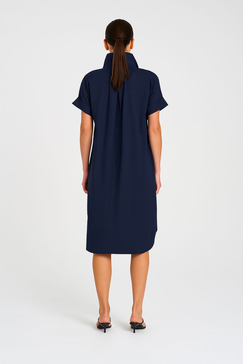 Woman wearing Mela Purdie Half Zip Dress F65 3022 in Navy, back view