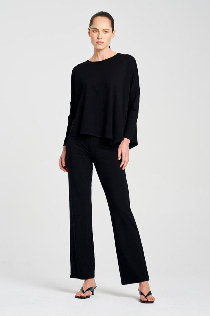 Woman wearing Long Pant in Black by Mela Purdie F01 100, front view styled with a black top.