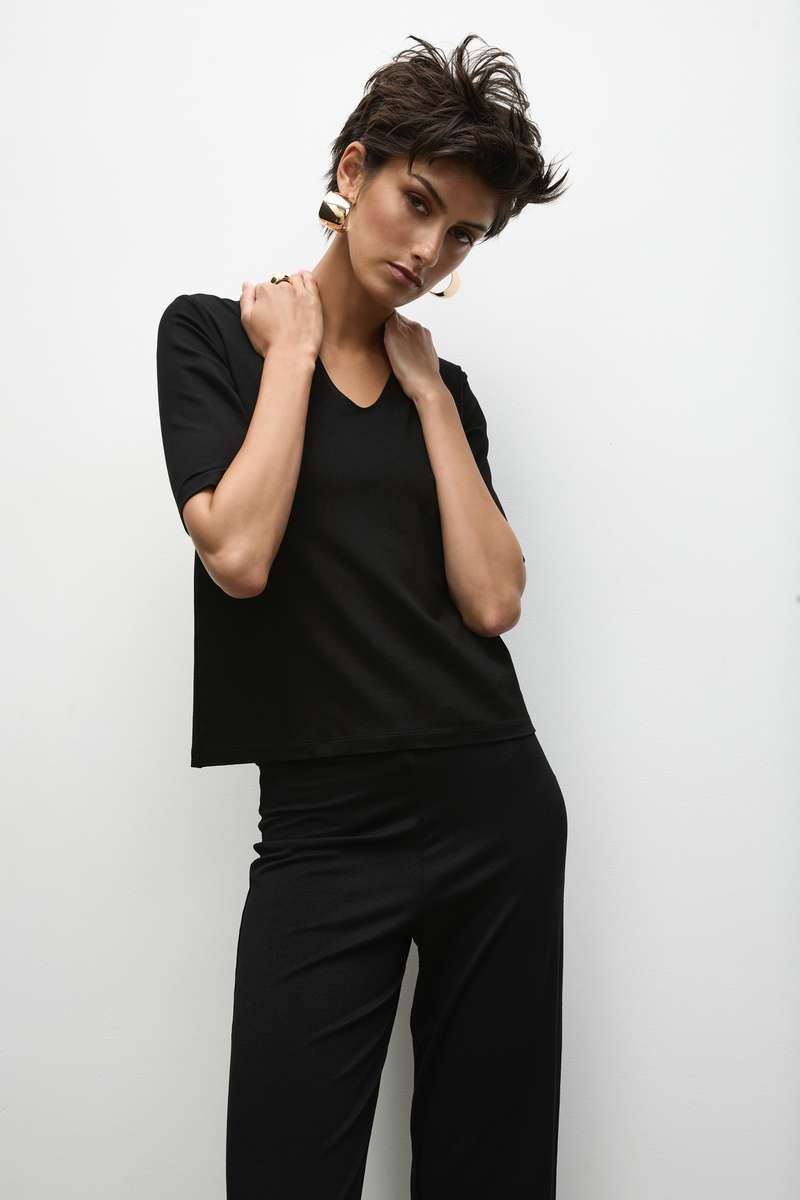 Woman wearing Long Pant in Black by Mela Purdie F01 100, upper-body outfit detail.