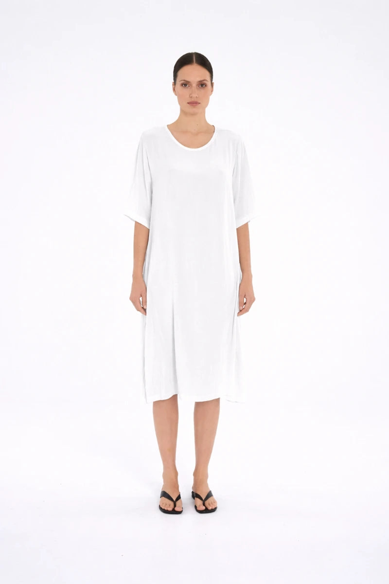 Woman wearing Mela Purdie Plaza Dress F67 3004 in White, front view