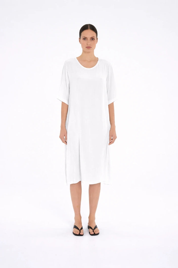 Woman wearing Mela Purdie Plaza Dress F67 3004 in White, front view