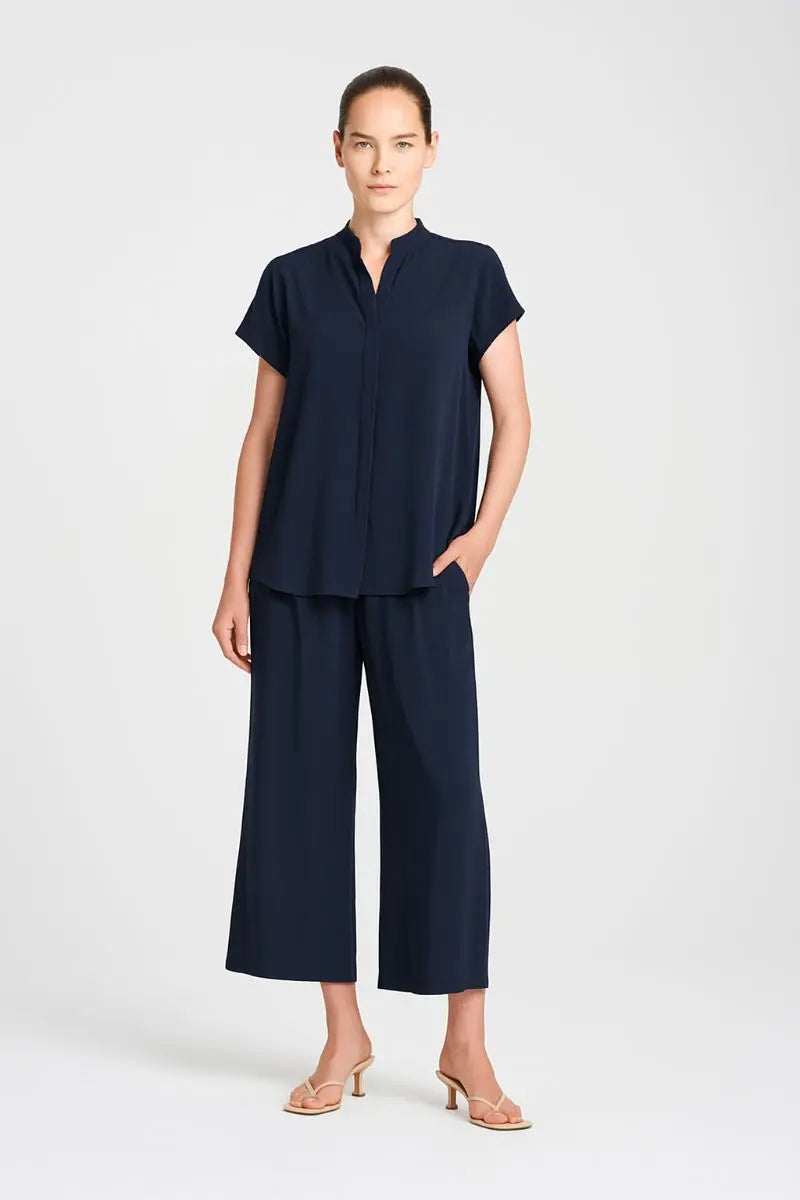 Woman wearing Mela Purdie Soft Stand Shirt F67 8629 in Navy with matching cropped wide-leg trousers, front view