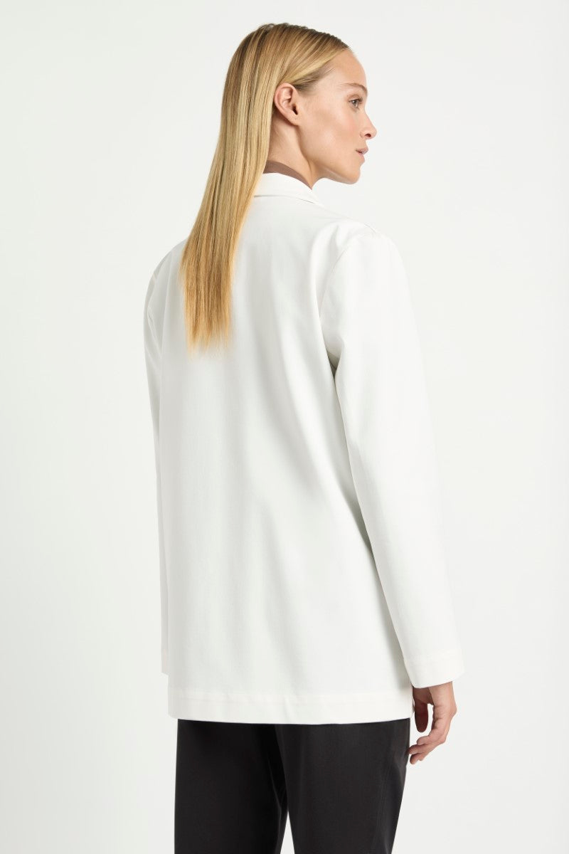 Woman wearing Stretch Blazer in Ivory by Mela Purdie F414 4129, back three-quarter view.