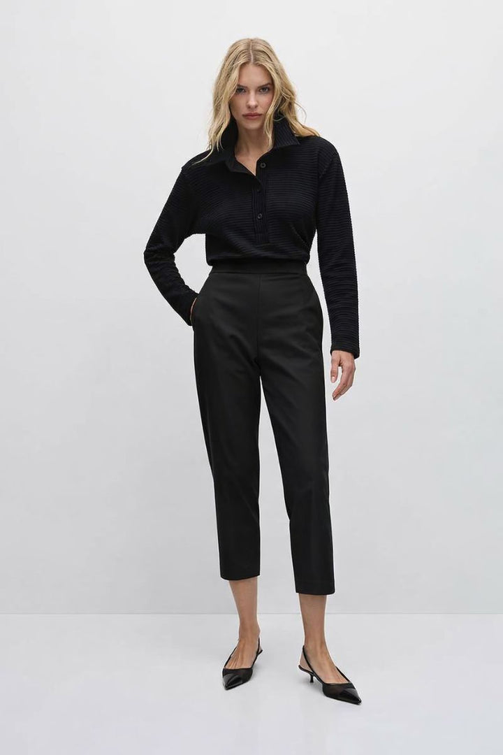 Woman wearing Mela Purdie Tapered Flat Pant in Black front view