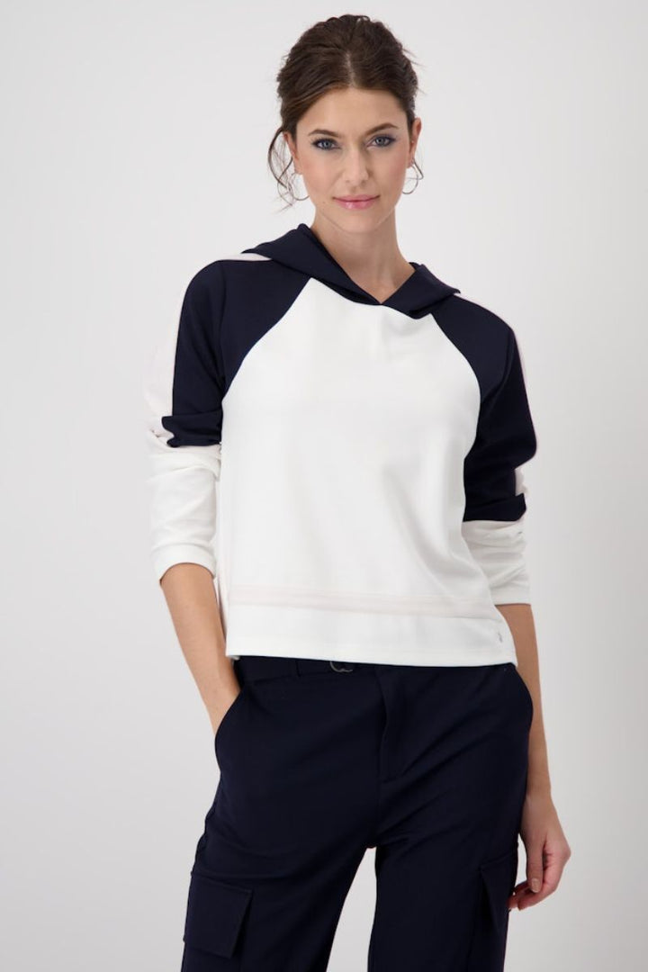Woman wearing Monari hooded sweatshirt in navy and white style 409090 front