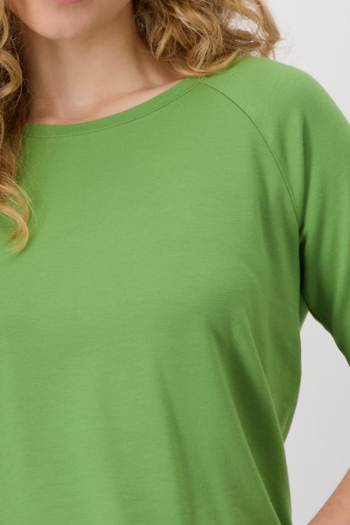 Woman wearing Monari T-shirt in avocado style 409372MNR closeup