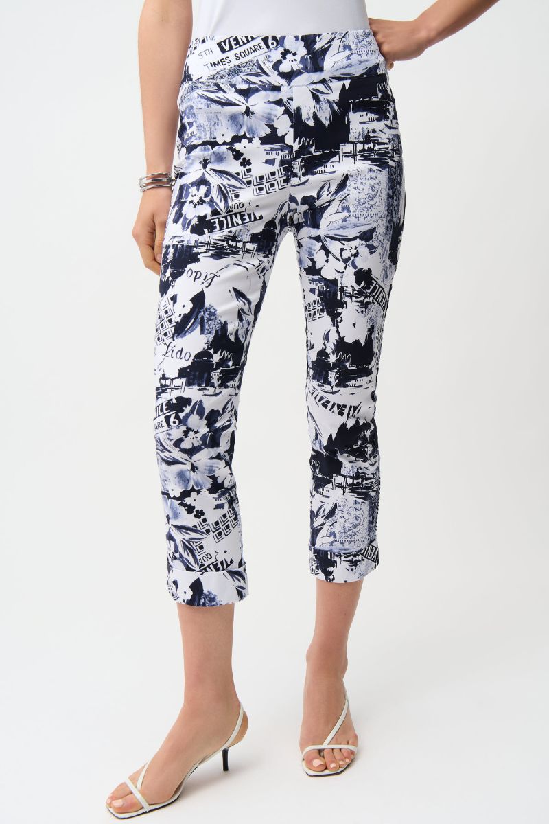 Woman wearing Joseph Ribkoff 261187 Millennium Conversational Print Crop Pull-On Pants fabric close-up in Navy