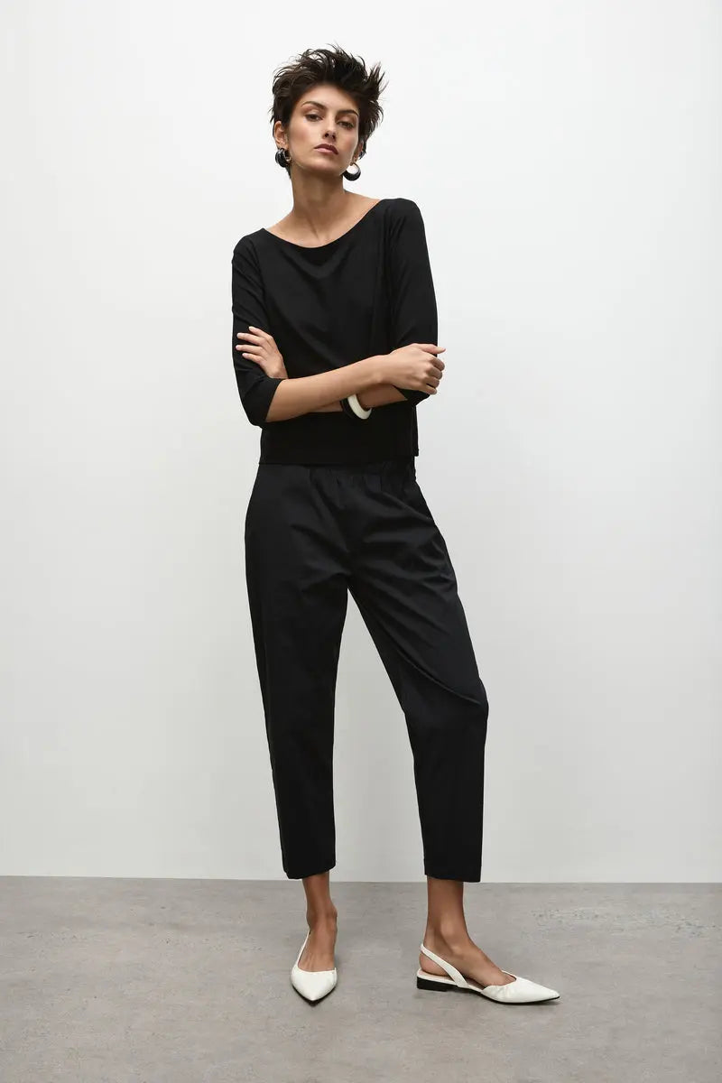 Woman wearing Nomad Pant in Microprene F65 1478 by Mela Purdie in Black, front view.