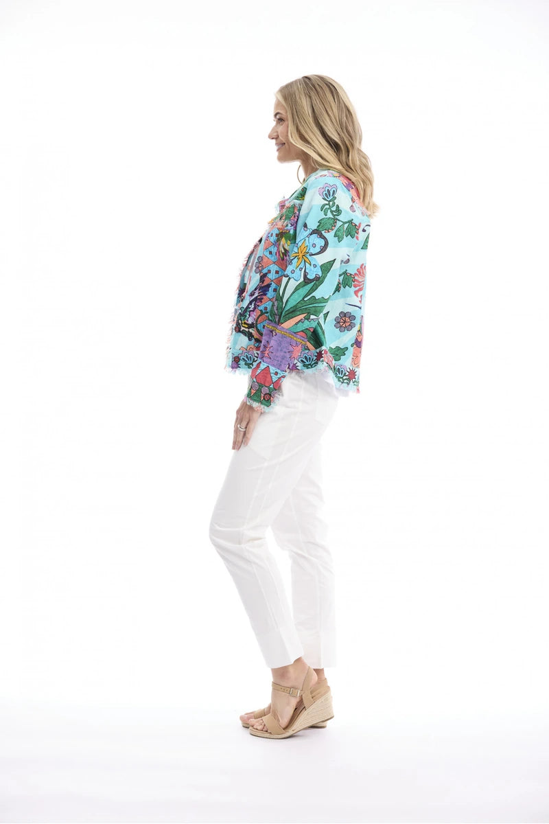 Woman wearing Orientique Provence Fringe Jacket Print 62823 side view showing colourful print and fringe hem