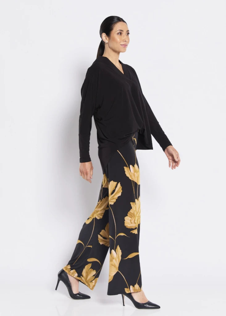 Woman wearing philosophy joey w26 joey wide leg slinky jersey pant greta side