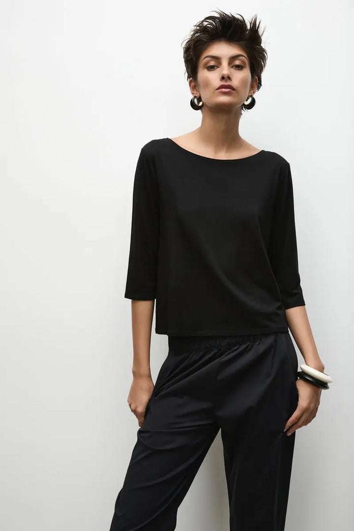 Woman wearing Relaxed Boat Neck in Matte Jersey F01 2630 by Mela Purdie in Black, front view showing the relaxed fit.
