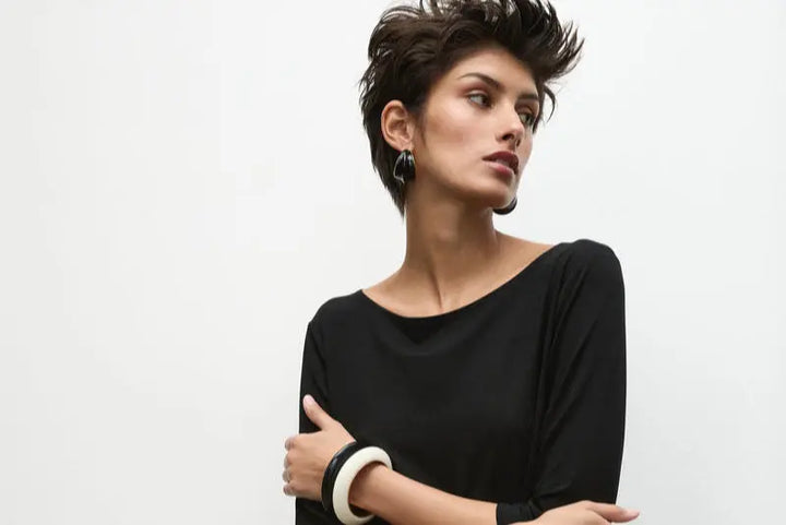 Woman wearing Relaxed Boat Neck in Matte Jersey F01 2630 by Mela Purdie in Black, detail of the boat neckline and three-quarter sleeves.