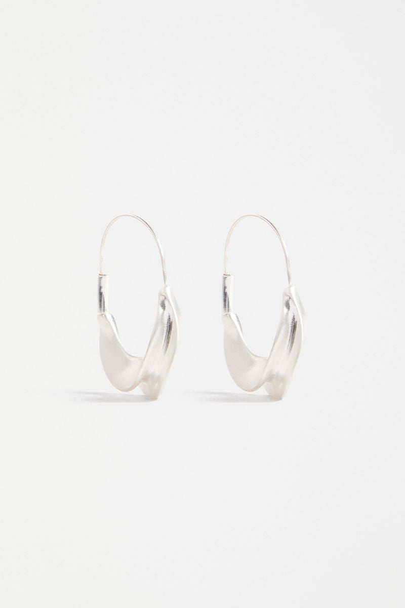 Pair of silver hoop earrings on a white background