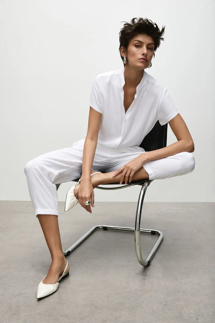 Woman wearing Soft Capri in White by Mela Purdie F67 1615, seated view.