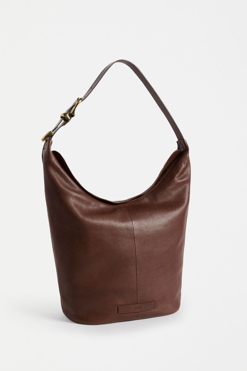 Brown leather handbag on a white background