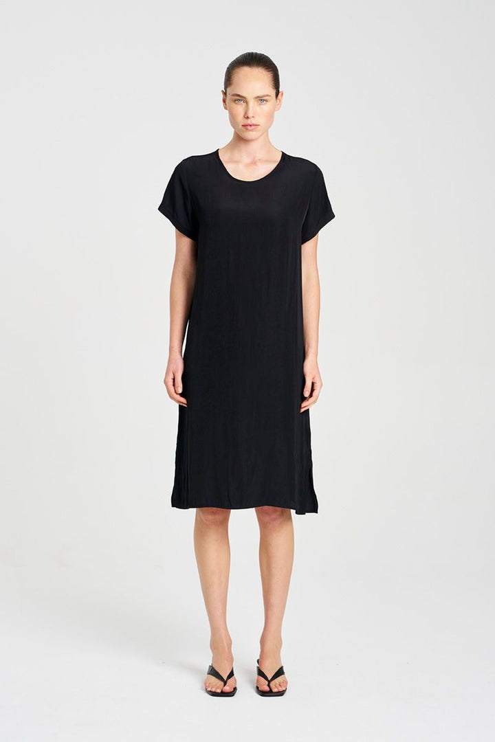 Woman wearing Travel T Dress in Maché F67 3203 by Mela Purdie in Black, front studio view.