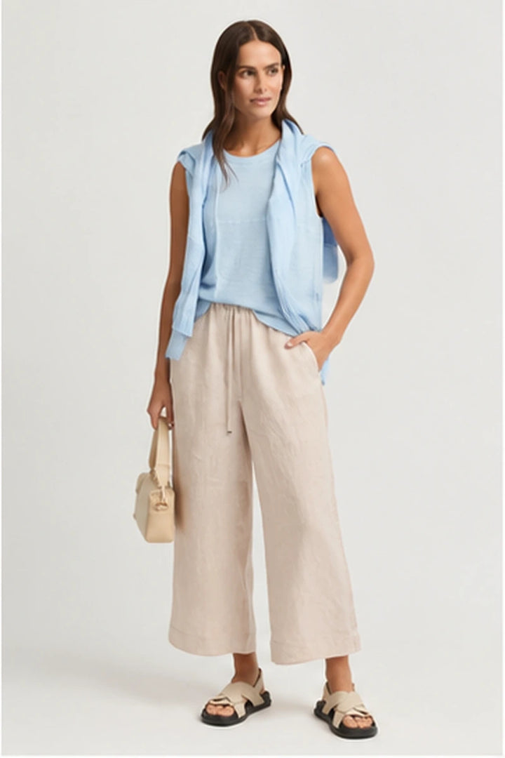 Yarra Trail Obscurity Knit YTWN7788 in Mist blue, styled with natural wide leg pants and sandals.