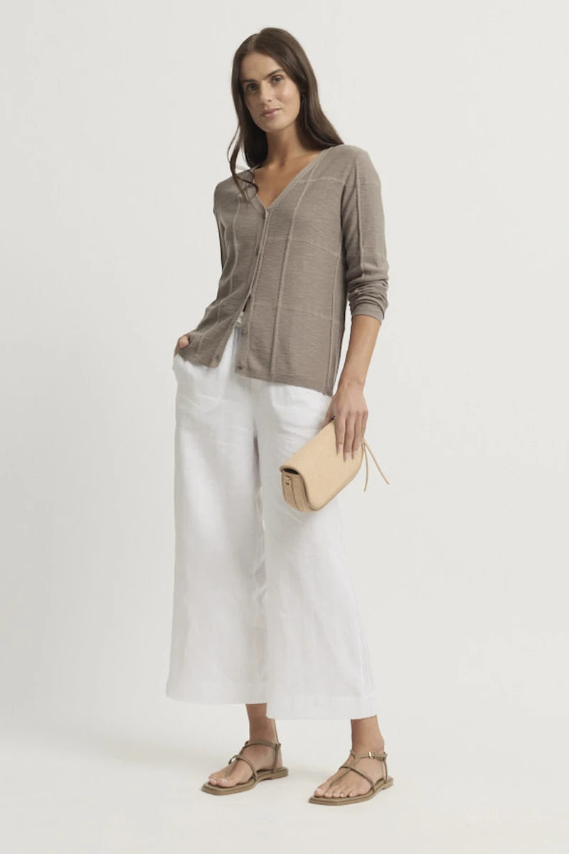 Yarra Trail Obscurity Knit Cardi YTWN7789 in Earth styled with white pants, seated front view.
