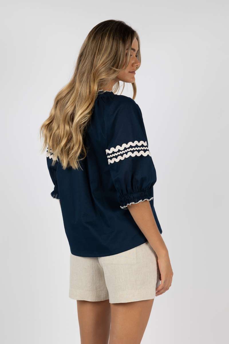 ziggy-blouse-in-navy-humidity-lifestyle-back-view_1200x