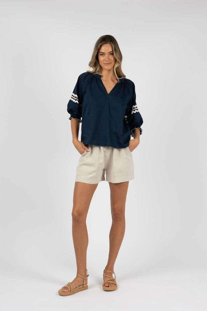 ziggy-blouse-in-navy-humidity-lifestyle-front-view_1200x